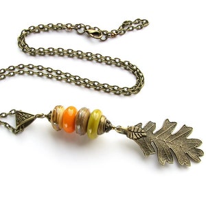 Oak Leaf and lampwork necklace on brass color chain, Orange Olive Gray beaded pendant, Handmade pendant Fall forest jewelry, Murano glass