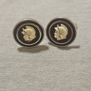 Swank round cufflinks featuring a raised Roman soldier or gladiator against a black background