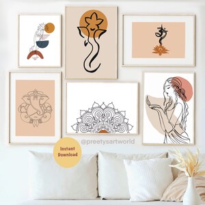 May include: Set of six minimalist line art prints featuring Hindu deities and symbols. The prints are in a neutral color palette of beige, brown, and white. The prints are framed and displayed on a white wall above a white couch with a wooden frame. The couch has two white pillows and a white throw blanket. There is a small wooden stool and two gold metal side tables with glass tops. The side tables are on a woven rug. The text "@preetyartworld" is visible on the bottom of the image.