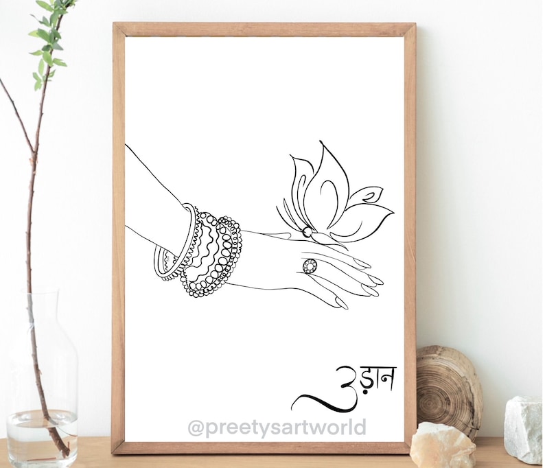 May include: A black and white line drawing of a hand with a ring on the finger, wearing bangles and holding a butterfly. The text "उड़ान" is written below the image.