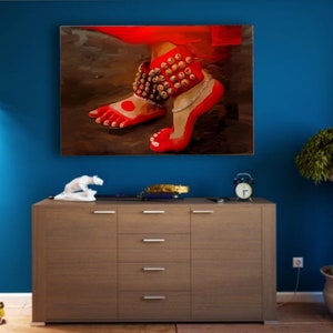 May include: A painting of a woman's feet wearing red shoes and anklets with bells. The feet are painted in a realistic style and the background is a dark brown.