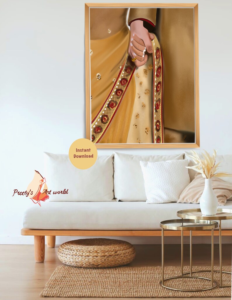 May include: A digital painting depicting a couple's hands clasped together. The woman is wearing a yellow and gold sari with red and gold trim. The man is wearing a brown suit. The painting is framed in a wooden frame.
