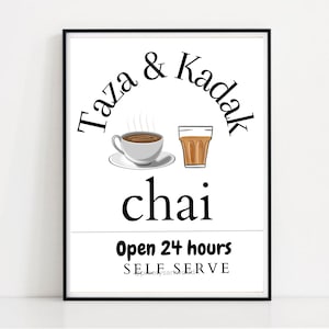 May include: A black and white sign with the text "Taza & Kadak chai" in a stylised font. The sign also includes illustrations of a cup of tea and a glass of chai. The text "Open 24 hours" and "Self Serve" are also included on the sign.