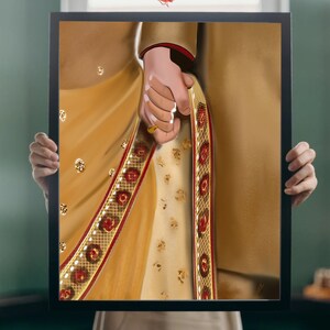 May include: A digital painting of a couple holding hands, the woman wearing a gold and red sari and the man wearing a gold sherwani. The painting is framed in black.