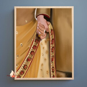 May include: A close-up of a couple holding hands, the woman wearing a gold and red sari, the man wearing a gold sherwani.