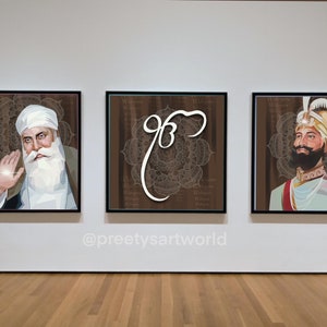 May include: Three framed art prints on a white wall. The left print features a portrait of a man with a white beard and turban. The middle print features a brown background with a white symbol. The right print features a portrait of a man with a turban and beard wearing a gold and white outfit.