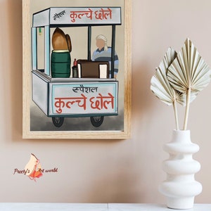 May include: A framed illustration of a street food vendor selling "Special Kulche Dhhole" from a cart. The vendor is wearing a white turban and a blue and white striped shirt. The cart is decorated with a blue and white sign with the text "Special Kulche Dhhole" in Hindi.