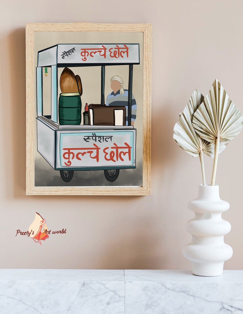 May include: A framed illustration of a street food vendor selling "Special Kulche Dhhole" from a cart. The vendor is wearing a white turban and a blue and white striped shirt. The cart is decorated with a blue and white sign with the text "Special Kulche Dhhole" in Hindi.