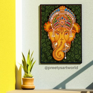 May include: A traditional Indian painting of the Hindu deity Ganesha, depicted with a golden head and trunk against a green background with swirling patterns. The painting is framed in black and features intricate details in the deity's headdress and jewelry.