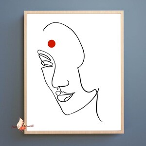 May include: A black and white line drawing of a face with a red dot on the forehead. The face is looking to the right and has a slight smile.