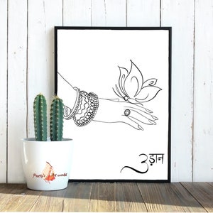 May include: Black and white line art print of a hand with a butterfly on it. The hand is wearing a bracelet and a ring. The print has the word "उड़ान" written in black below the image.