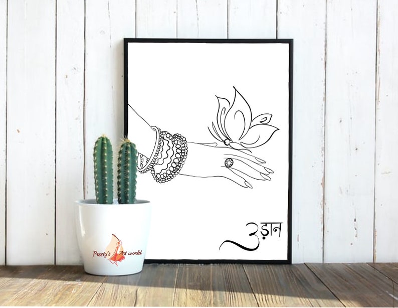 May include: Black and white line art print of a hand with a butterfly on it. The hand is wearing a bracelet and a ring. The print has the word "उड़ान" written in black below the image.