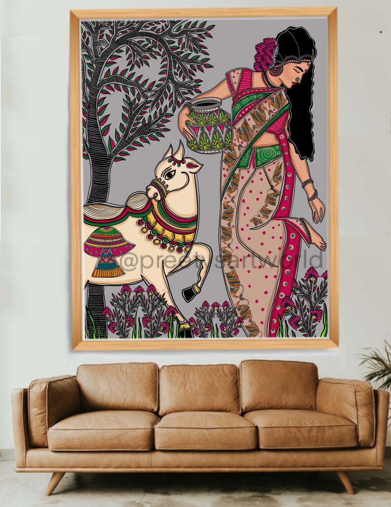 May include: A colorful illustration of a woman in a traditional Indian sari holding a pot, walking with a cow in a field of flowers. The artwork is framed in a wooden frame.