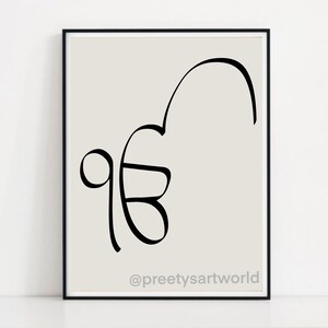 May include: A black and white line art print of the Gurmukhi script for the word "Waheguru" on a light gray background. The print is framed in a black frame and has the text "@preetysartworld" at the bottom.