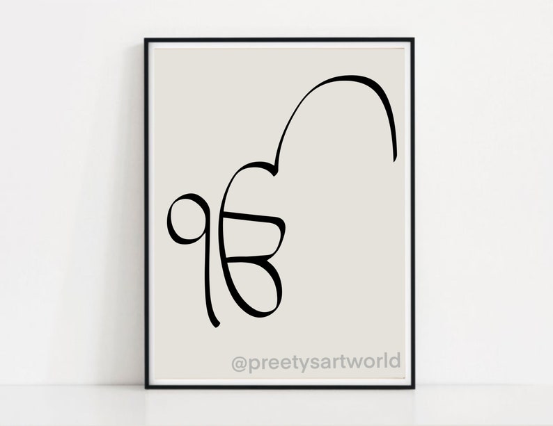May include: A black and white line art print of the Gurmukhi script for the word "Waheguru" on a light gray background. The print is framed in a black frame and has the text "@preetysartworld" at the bottom.