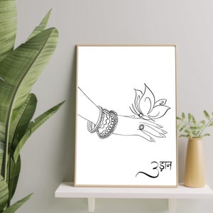 May include: Black and white line art print of a hand with bangles reaching out to a butterfly. The word "उड़ान" is written in black below the image.