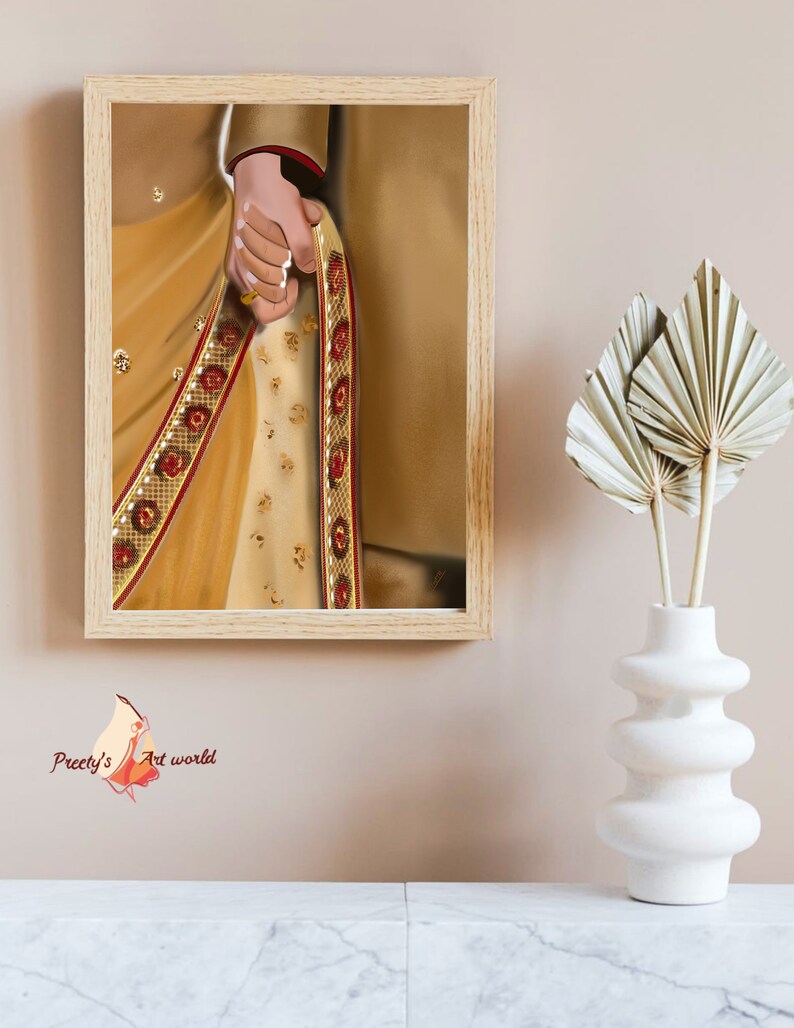 May include: A framed illustration of a couple's hands, the woman's hand is adorned with a gold ring and a traditional Indian saree with gold and red embroidery.