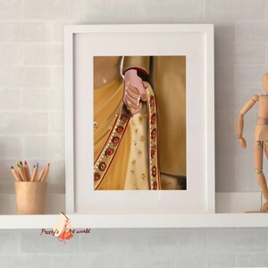 May include: A framed illustration of a couple holding hands, the woman wearing a gold and red sari with intricate embroidery.