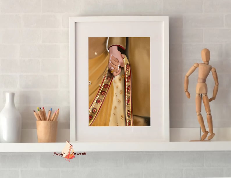 May include: A framed illustration of a couple holding hands, the woman wearing a gold and red sari with intricate embroidery.