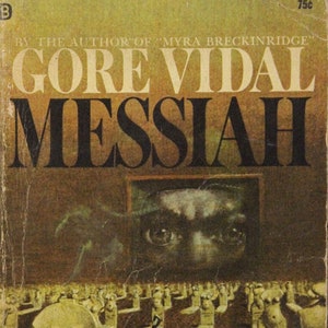 May include: A vintage paperback book cover with a dark brown background and a large, bold title: "GORE VIDAL MESSIAH". The cover features a spooky image of a face with large eyes, looking out from a window, and a graveyard scene with tombstones.