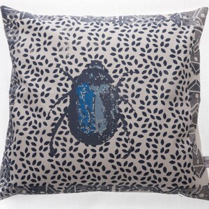 Blue beetle on leaves cushion cover