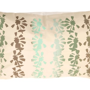 Green &#39;cut-out&#39; floral cushion cover.