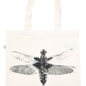 Hand-printed organic cotton tote bag featuring a dragonfly and lilies on cream ground.