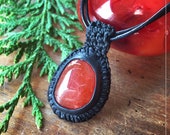 Unique Carnelian necklace - pendant in leather and gemstone.