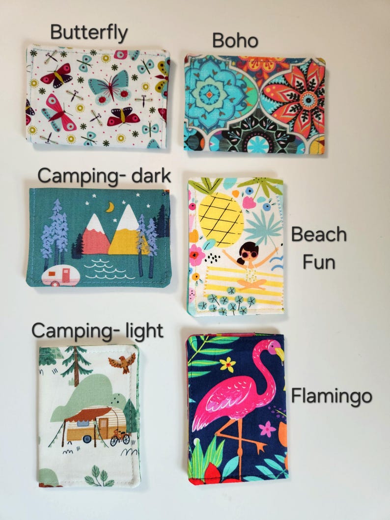 May include: Six rectangular fabric card holders featuring various prints: Butterfly, Boho, Camping-dark, Beach Fun, Camping-light, and Flamingo. Each item displays a distinct pattern including insects, geometric shapes, landscapes, and animals.