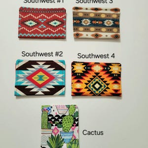 May include: Five rectangular fabric card holders featuring various patterns. Southwest #1 is red with geometric shapes. Southwest #2 has a brown, blue, and yellow diamond design. Southwest 3 features brown and blue stripes. Southwest 4 is orange and black. Cactus shows potted plants.