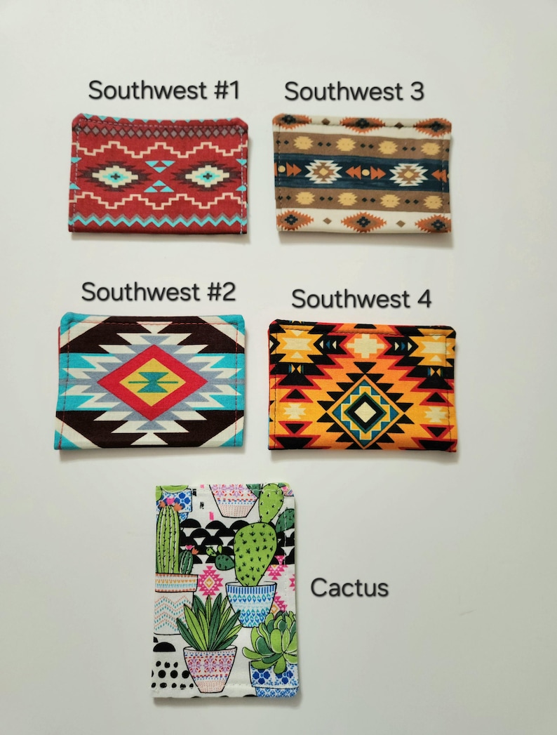 May include: Five rectangular fabric card holders featuring various patterns. Southwest #1 is red with geometric shapes. Southwest #2 has a brown, blue, and yellow diamond design. Southwest 3 features brown and blue stripes. Southwest 4 is orange and black. Cactus shows potted plants.