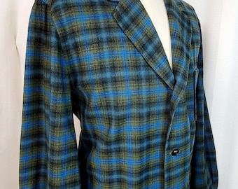 May include: A blue, green, and black plaid blazer with a single button closure and a patch pocket on the left side. The blazer is on a mannequin.