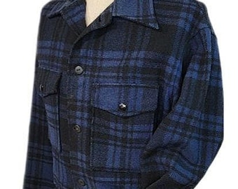 May include: A blue and black plaid flannel shirt jacket with a button-up front and two flap pockets.