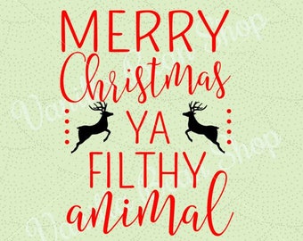 May include: Red text on a green background reads "Merry Christmas ya filthy animal" with two black reindeer silhouettes on either side of the text.