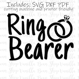 May include: Black and white graphic design of the text "Ring Bearer" with two interlocking rings and a diamond on top. The text "Includes: SVG DXF PDF cutting machine and printer friendly!" is at the top of the image.