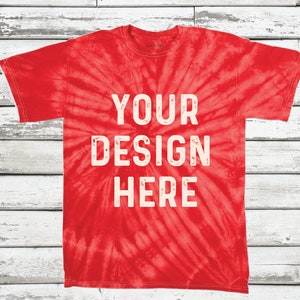 May include: Red tie-dye t-shirt with the text "YOUR DESIGN HERE" in white.