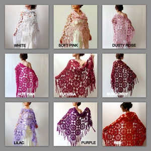 May include: Nine crocheted shawls in various colors, including white, soft pink, dusty rose, hot pink, fuchsia, burgundy, lilac, purple, and red. Each shawl features a delicate floral pattern and fringe trim.