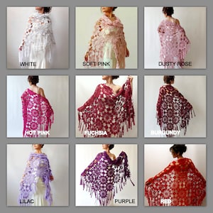 May include: A collection of nine crocheted shawls in various colors, including white, soft pink, dusty rose, hot pink, fuchsia, burgundy, lilac, purple, and red. Each shawl features a floral pattern and fringe.
