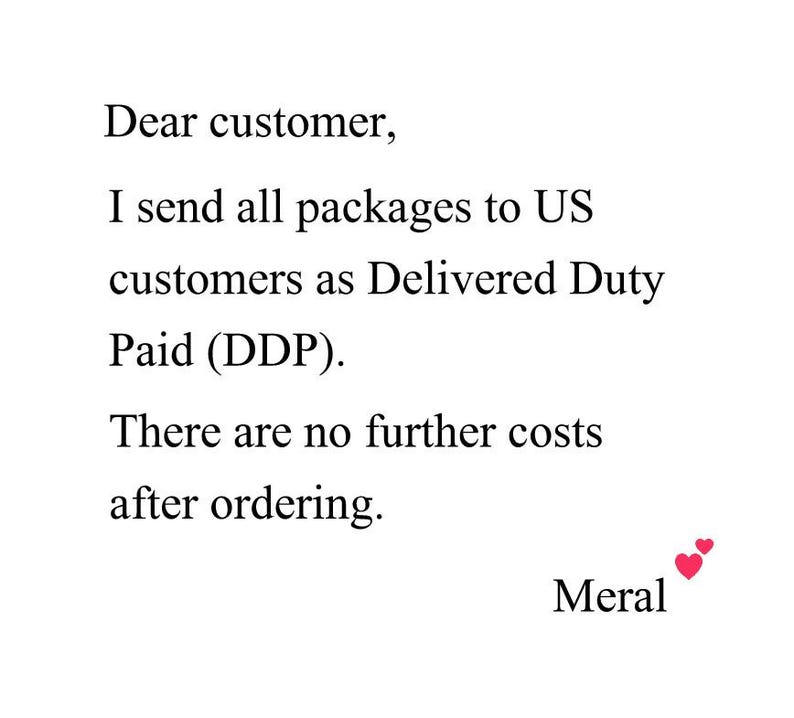 May include: White background with black text that reads "Dear customer, I send all packages to US customers as Delivered Duty Paid (DDP). There are no further costs after ordering." The name "Meral" is at the bottom with two red hearts.