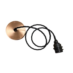 May include: A black electrical cord with a gold metal ceiling plate and a black light bulb socket.