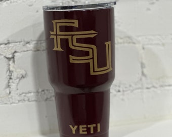 May include: A maroon YETI tumbler with a gold FSU logo.