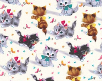 May include: A white background with a repeating pattern of kittens wearing bows. The kittens are in various poses and colors, including gray, brown, and black. There are also small pink, blue, and yellow stars and butterflies scattered throughout the pattern.