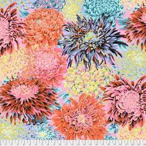May include: A vibrant floral pattern featuring large chrysanthemum blooms in shades of pink, orange, blue, yellow, and black against a pink background. The image includes a ruler at the bottom, with measurements in centimetres.