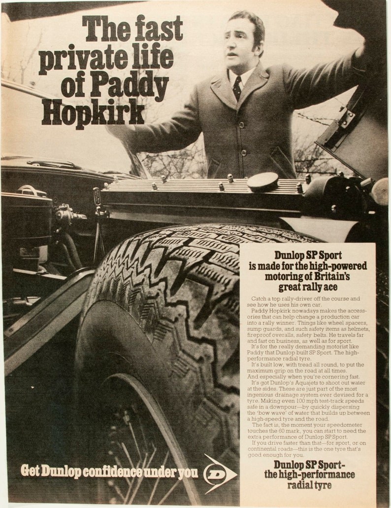 May include: A black and white photograph of a man standing next to a car. The man is wearing a suit and tie. The car has a tyre with the text "Dunlop SP Sport" on it. The text "Get Dunlop confidence under you" is at the bottom of the image. The text "Dunlop SP Sport - the high-performance radial tyre" is at the bottom of the image.