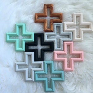 Geometric cross silicone teether with texture. Baby teething toy in copper, grey, white, pink, mint, seafoam and grey marble. BPA free. image 2