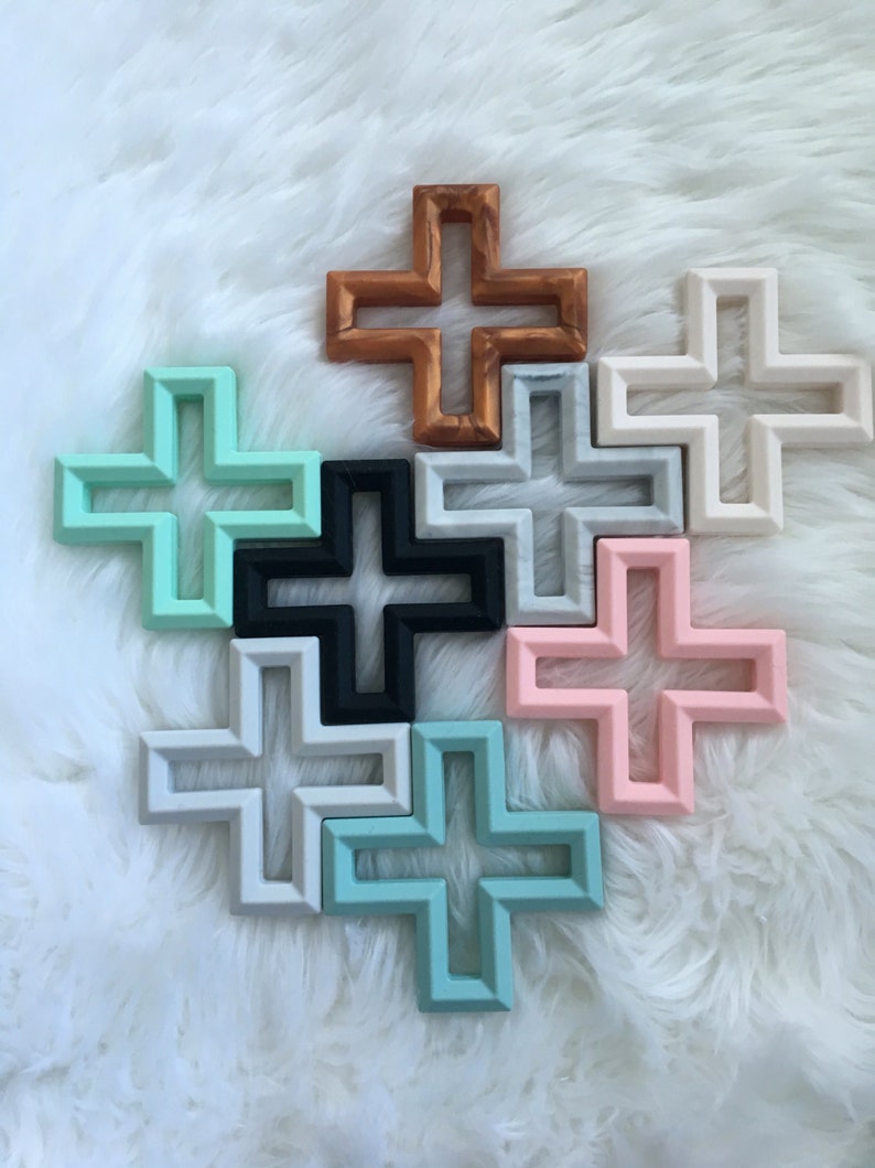 Geometric cross silicone teether with texture. Baby teething toy in copper, grey, white, pink, mint, seafoam and grey marble. BPA free. image 2