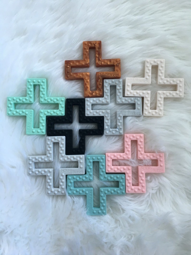 Geometrischer Kreuz Silikon Beißer mit Textur. Baby-Greifvogel aus Kupfer, grau, weiß, rosa, mint, Seefoam und grauem Marmor. BPA frei. Bild 3