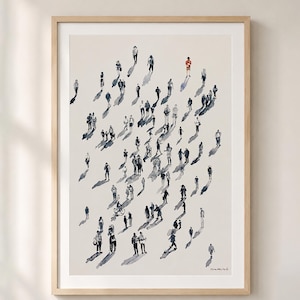May include: A framed art print featuring a watercolor illustration of a crowd of people walking on a light beige background. The figures are rendered in dark gray ink with long shadows, while one single figure is highlighted in bright red.