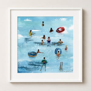 May include: A framed watercolor painting depicting a light blue ocean scene with multiple figures swimming and floating in the water. Several individuals are using red and blue inflatable rings while splashing in the bright, textured blue waves.