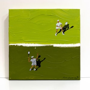 May include: A square canvas painting featuring two tennis players in white outfits on a split-tone green background. The top half is a bright lime green, the bottom half is a dark olive green, separated by a white horizontal line. A signature is visible.